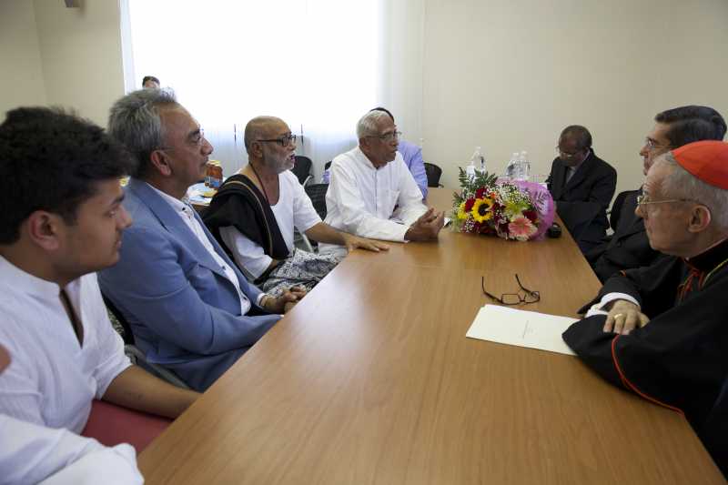  Morari Bapu meets Eminence Cardinal Jean-Louis Tauran, the President of the Pontifical Council for Interreligious Dialogue (PCID). peer Lord Popat of Harrow is also seen . 