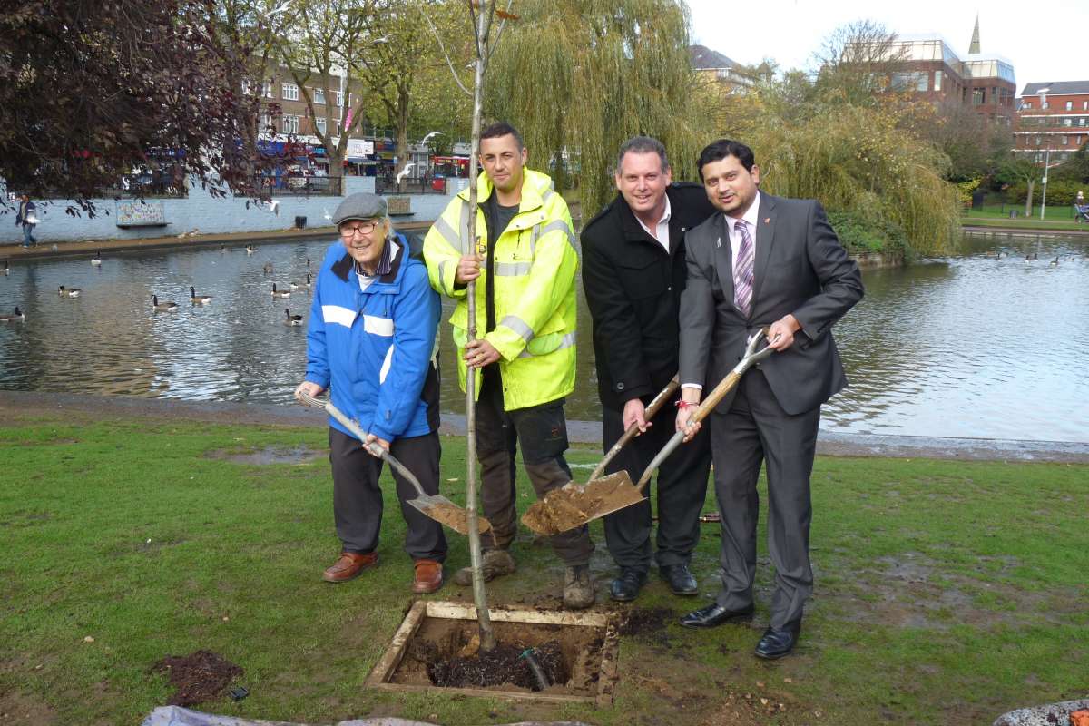 Councillor Sachin Gupta (right) joins members of the Feltham History Group Eddie Menday and Andi Barnes planting the first of 1,000 trees for Hounslow