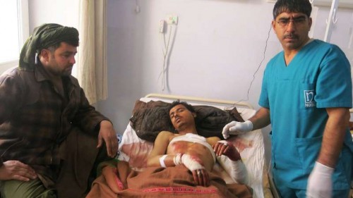 An injured man receives treatment at a hospital