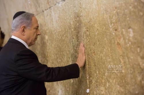 Israeli Prime Minister Benjamin Netanyahu prays at the Jewish site of the Western Wall in the Old City of Jerusalem, on March 18, 2015. 