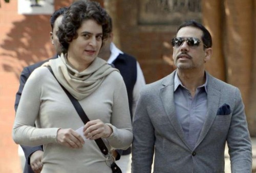 Daughter of former Prime Minister Rajiv Gandhi and UPA Chairperson Sonia Gandhi, Priyanka Gandhi and her husband Robert Vadra after casting their votes during Delhi Assembly Polls in New Delhi on Dec.4, 2013. (Photo: IANS)