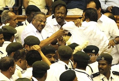 Kerala legislators go berserk in the state assembly during the budget session in Thiruvananthapuram on March 13, 2015.