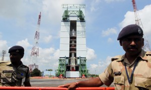 Paramilitary soldiers guard the Polar Satellite Launch Vehicle (PSLV-C25) at Satish Dhawan Space Center at Andhra Pradesh's Sriharikota on Oct.30, 2013. Indiaâ??s Mars orbiter mission is scheduled to be launched by the Polar Satellite Launch Vehicle (PSLV-C25) on Nov. 5. (Photo: IANS)