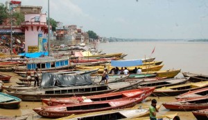 Boats remain anchored on the ghats of Ganga river in Varanasi as water level in the river is increasing; on Aug 7, 2014. (Photo: IANS)