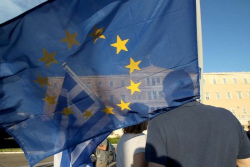 Demonstrators rally in front of the Greek Parliament to support Greece's place in the Eurozone, in Athens, Greece, June 18, 2015. As the potential exit of Greece from the Eurozone monetary union is hanging over negotiations with Greek international creditors, the rally was organized to promote the idea of "staying in Europe"