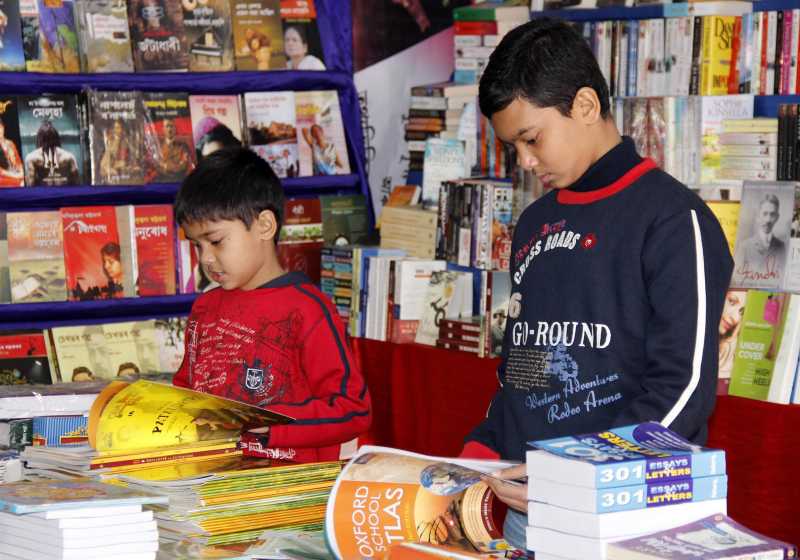 Children go through books at the 15th North East Book Fair in Guwahati 