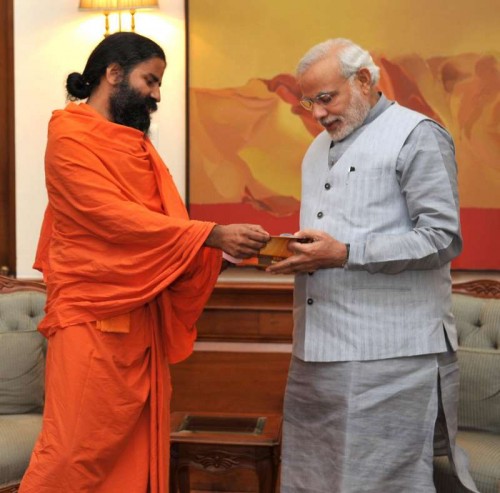 THE BLUNDER: Yoga Guru Ramdev calls on Prime Minister Narendra Modi, in New Delhi. Modi is providing Z Category security to the controversial Guru who faces tax evasion and forex violation charges