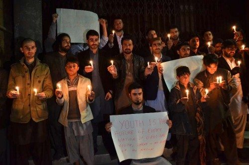 Members of Pakistani civil society light candles for the victims of an attack by militants on a school in southwest Pakistan's Quetta on Dec. 16, 2014. A total of 148 people including 132 students and nine staff members were killed and 133 others injured in Tuesday's terror attack at an army-run public school in Pakistan's northwest city of Peshawar, said a spokesman of the Pakistani army.