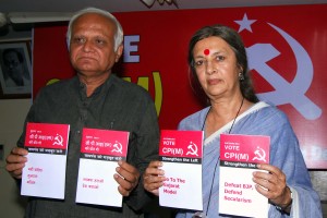 CPI-M leaders Brinda Karat and Arun Mehta release booklets against communalism in New Delhi on March 24, 2014. (Photo: IANS)