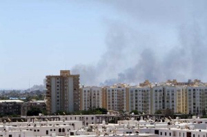 Smoke rises from the streets as heavy fighting goes on between rival militia groups in Tripoli, Libya. Deadly clashes erupted between Islamist fighters and pro-secular militias since July 13.