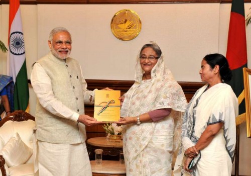 rime Minister Narendra Modi presents to the Bangladesh Prime Minister Sheikh Hasina, a transcript of Parliamentary debates on LBA, in Dhaka, Bangladesh on June 6, 2015. Also seen Chief Minister of West Bengal, Kumari Mamata Banerjee. 