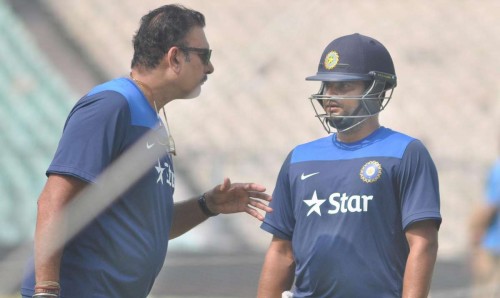 Kolkata: Team India director Ravi Shastri with Suresh Raina during a practice session ahead of the 4th ODI against Sri Lanka at the Eden Gardens in Kolkata, on Nov 12, 2014. (Photo: Kuntal Chakrabarty/IANS)