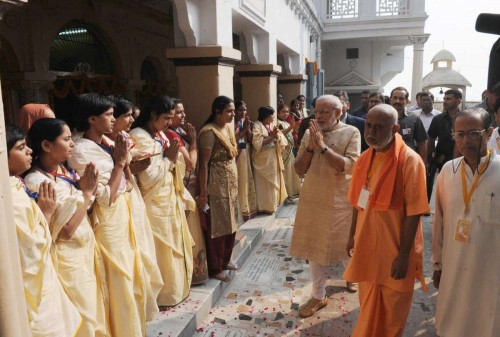 Varanasi: Prime Minister Narendra Modi visiting at the Maa Anandmayee Ashram, in Varanasi on Nov. 8, 2014. 