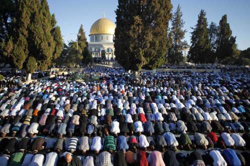 Muslims pray in front of the Dome of the Rock at the compound known to Muslims as al-Haram al-Sharif and to Jews as the Temple Mount in Jerusalem's Old city, on Oct. 4, 2014 on the first day of Eid al-Adha. Muslims around the world celebrate Eid al-Adha to mark the end of the Haj by slaughtering sheep, goats, cows and camels to commemorate Prophet Abraham's willingness to sacrifice his son Ismail on God's command. 