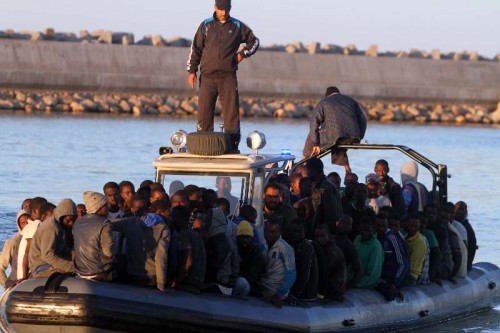 Some illegal immigrants are on a boat after being rescued in Garabulli, Libya, on Nov. 20, 2014. Libya's coast guard on Thursday rescued dozens of illegal immigrants near the coastal town of Garabulli, some 60 kilometers from Tripoli. Libya has long been a transit point for migrants seeking to reach Malta, Italy, and other places in Europe because of its proximity and relatively loose border control.