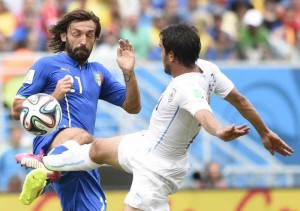 Italy's Andrea Pirlo vies for the ball during a Group D match between Italy and Uruguay of 2014 FIFA World Cup at the Estadio das Dunas Stadium in Natal, Brazil