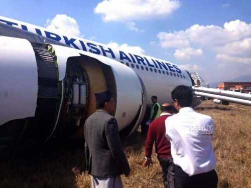 Nepal's Minister for Culture, Tourism and Civil Aviation Deepak Chandra Amatya (1st L) visits the incident site of a Turkish Airlines Airbus plane at Tribhuwan International Airport in Kathmandu, Nepal, March 4, 2015. Turkish Airlines Flight TK 726 skidded off the runway while landing at the Nepal's Tribhuwan International Airport Wednesday morning with all 227 passengers on board safe.