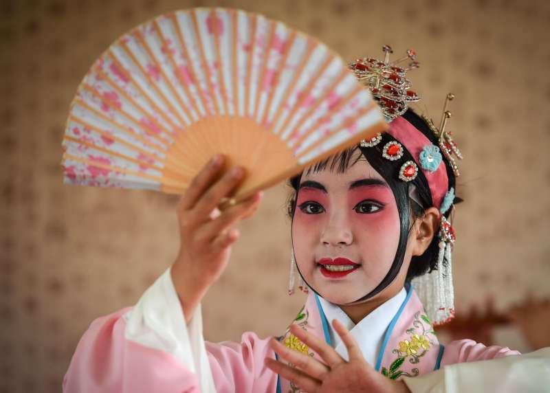 A Chines dancer performing a traditional dance