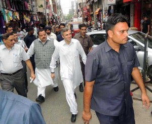 Jammu and Kashmir Chief Minister Omar Abdullah visiting Raghunath Bazar in Jammu on AUg. 9, 2014. (Photo: IANS)