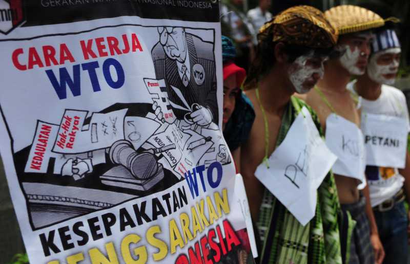  Anti-World Trade Organization (WTO) activists attend a demonstration at the office