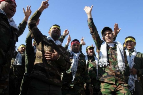 Government-backed Sunni Arab tribesmen from paramilitary groups are reviewed at the end of their training period to fight Islamic State (IS) militants in the Kirkuk, North Iraq, Feb. 26, 2015.