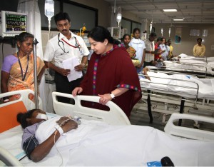 Tamil Nadu Chief Minister J Jayalalithaa meets an accident victim who got injured after a portion of a 11-storey under construction building collapsed at Moulivakkam in Chennai Saturday evening, on June 29, 2014. (Photo: IANS)