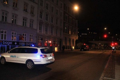  A police vehicle parks near the site of shooting in Copenhagen, Denmark, early Feb. 15, 2015. A shooting occurred near Norreport subway station early Sunday, injuring three people including two policemen. This is the second shooting in the capital city recently after another shooting Saturday night.