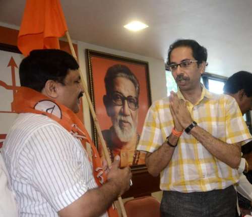 NCP leader Kishor Kanhere joins Shiv Sena in presence of Shiv Sena chief Uddhav Thackeray in Mumbai on July 14, 2014. (Photo: Sandeep Mahankal/IANS)