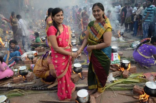 Women celebrate `Pongal` at Dharavi in Mumbai on Jan.14, 2015. 