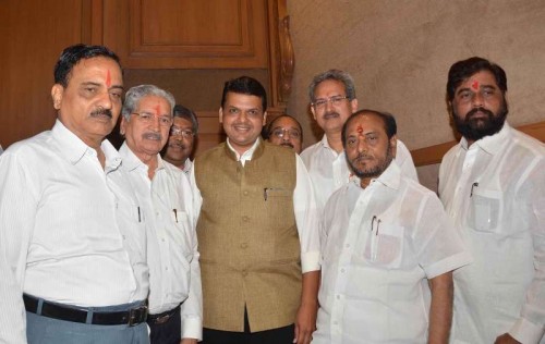  Maharashtra Chief Minister Devendra Fadnavis during a press conference with Shiv Sena leaders Subhas Desai and Divakar Ravate in Mumbai, on Dec 4, 2014. 