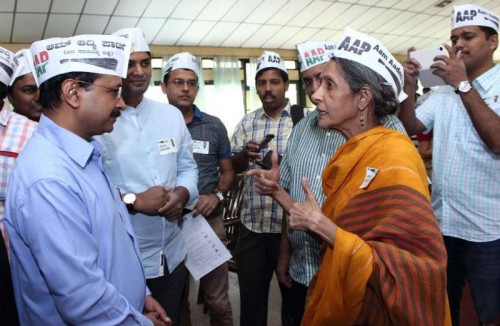  Aam Aadmi Party (AAP) leader Arvind Kejriwal interacts with party leaders during a programme 