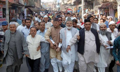 Muslims stage a demonstration against the reported conversion of 60 Muslim families living in a slum on Agra's outskirts, in Agra on Dec 10, 2014.