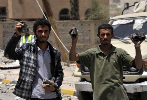  People show shrapnels in civilian areas in Sanaa, Yemen, on April 20, 2015. At least 60 people were killed and 49 others wounded in Yemen's capital of Sanaa on Monday morning in one of the fiercest air raids by Saudi-led coalition forces that began more than three weeks ago.