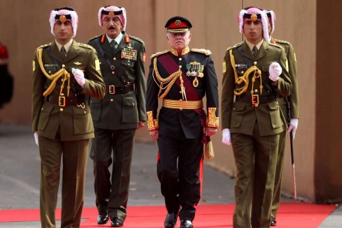 Jordanian King Abdullah II reviews the honour guard 