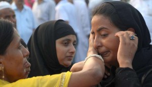 Haj pilgrims share emotional moments with their relatives ahead of leaving for Mecca at Haj House in Lucknow 