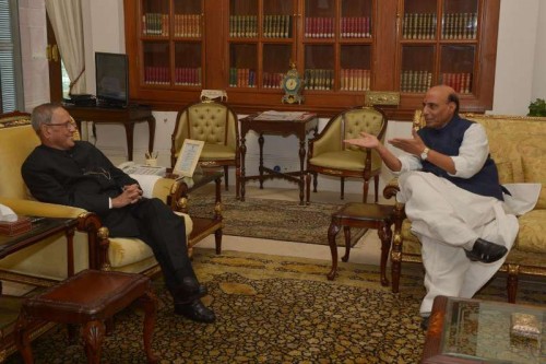 Union Home Minister Rajnath Singh calls on President Pranab Mukherjee to wish him on new year at Rashtrapati Bhavan in New Delhi, on Jan 1, 2015.