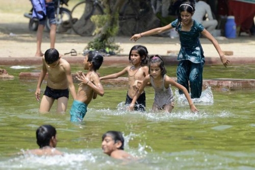 Children beat the heat in New Delhi. 