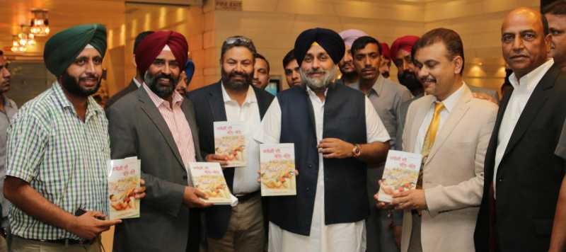Punjab Deputy Chief Minister Sukhbir Singh Badal launches `Kabaddi Di Balle Balle` a book authored by Dr. Chahal in Chandigarh on July 25, 2014. (Photo: IANS)