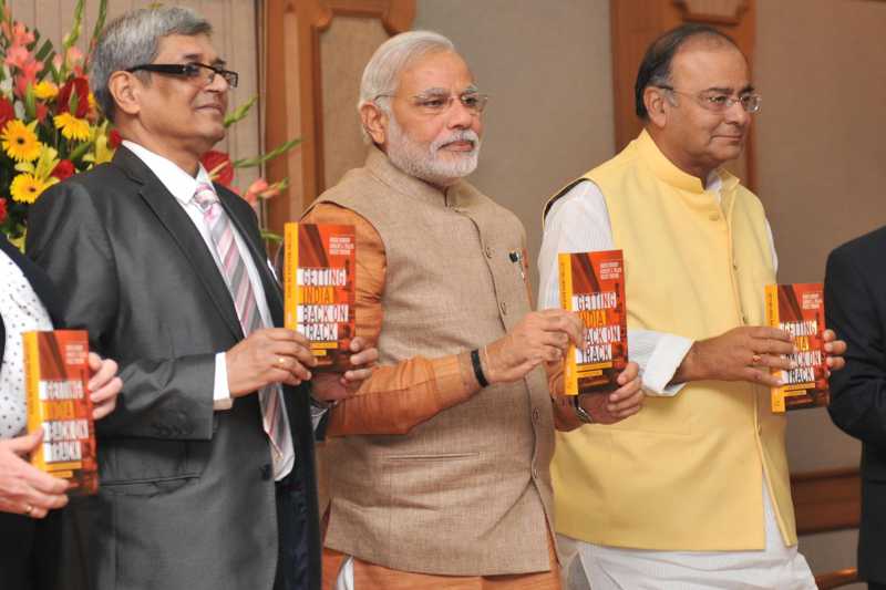 Prime Minister,Narendra Modi releasing the book "Getting India Back on Track" An Action Agenda for Reform, in New Delhi on June 8, 2014. The Union Minister for Finance, Corporate Affairs and Defence, Shri Arun Jaitley is also seen