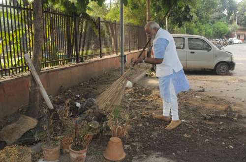 Prime Minister Narendra Modi cleans the premises of Mandir Marg Police Station during his surprise visit, in New Delhi.