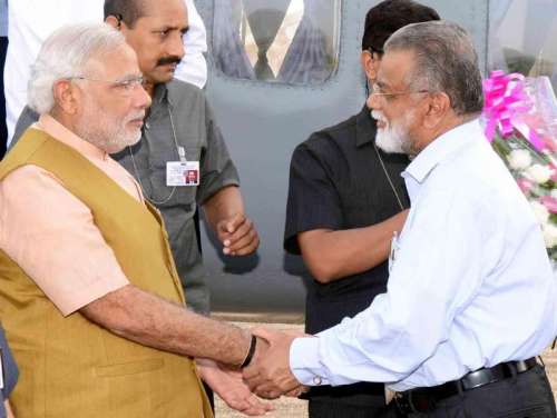 ISRO chairman K Radhakrishnan with  Prime Minister Narendra Modi at Sriharikota of Andhra Pradesh on June 29, 2014. 