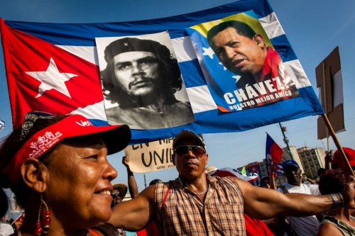 (140501) -- HAVANA, May 1, 2014 (Xinhua) -- People participate in the May Day parade organized by the Cuban Workers Union (CTC) at Revolution Square in Havana, capital of Cuba, on May 1, 2014. According to an official estimate, some 600,000 workers joined the parade. (Xinhua/Liu Bin)