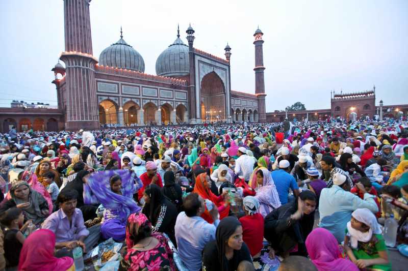 Muslims break their fast in front of Jama Masjid in New Delhi on July 27, 2014. (Photo: IANS)