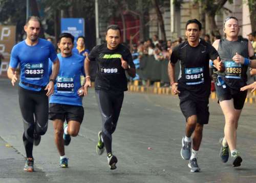 Anil Ambani chairman of Anil Dhirubhai Ambani Group (ADAG) participates in Mumbai Marathon 2014, in Mumbai on Jan.19, 2014. (Photo: Sandeep Mahankal/IANS)