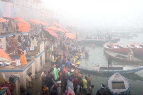  Devotees throng the banks of Ganga river for the holy dip on Makar Sankranti in Varanasi on Jan 14, 2015.