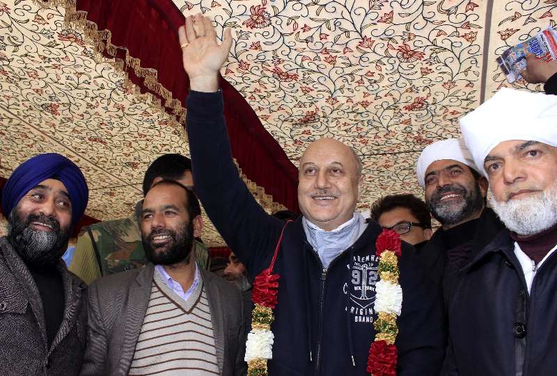 Srinagar: Actor Anupam Kher campaigns for Peoples Republican Party (PRP) ahead of Jammu and Kashmir assembly polls in Srinagar on Nov 24, 2014. (Photo: IANS)