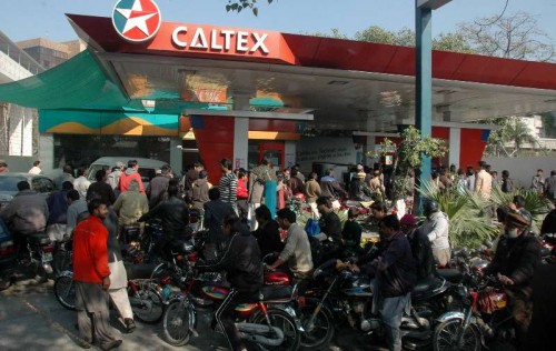 Motorbike riders queue at a fuel station due to petrol shortage in east Pakistan's Lahore, Jan. 16, 2015. Shortage of petrol continued on the fourth day in various areas of Punjab including Lahore whereas Federal Minster for Petroleum Shahid Khaqan Abbasi has assured that situation will be improved.