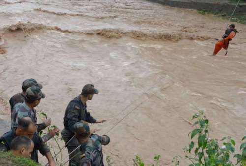 Soldiers rescue a woman trapped in flood hit Jammu and Kashmir