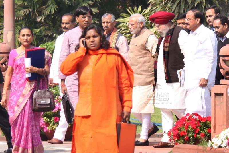 Prime Minister Narendra Modi, the Union Minister for Urban Development, Housing and Urban Poverty Alleviation and Parliamentary Affairs M. Venkaiah Naidu and other BJP MPs after attending a BJP parliamentary party meeting at the Parliament Library in New Delhi (File)