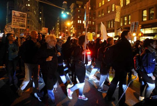 People gather for a Ferguson protest in New York Nov. 25, 2014. Tens of thousands of people in 90 cities of the U.S. held rallies on Tuesday to protest against a grand jury's deciding not to indict a white officer who shot dead a black teen in Ferguson of Missouri. 